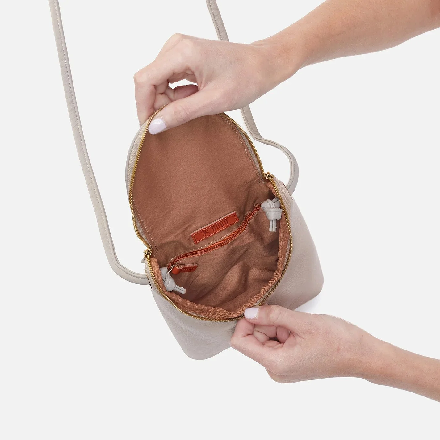 Hobo handbags - the fern crossbody bag in taupe colored leather