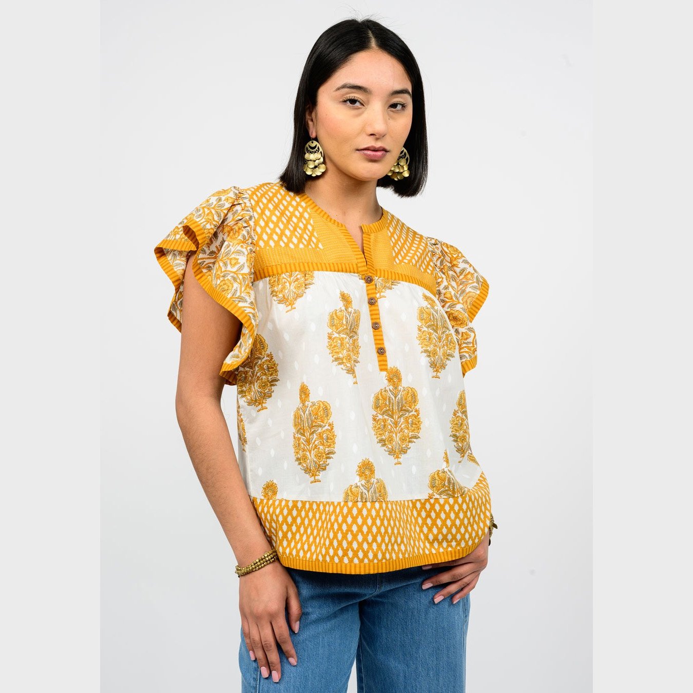 A cute top by Ivy Jane clothing, the patched patterns top in gold color combination.