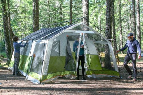 The  Ozark Trail 8-Person Family Cabin’s  setup is more complicated and multiple people are needed