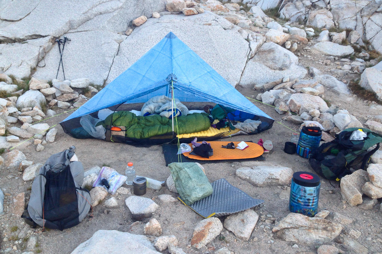 A Thru-hikers camp including: Zpacks Hexamid solo-plus (the older version of the  Plexamid Tent ),  Therm-A-Rest Z-Seat  &amp;  XLite Sleeping Pad ,  BearVault BV500 Bear Canisters ,  ULA Catalyst Backpack , ETC.