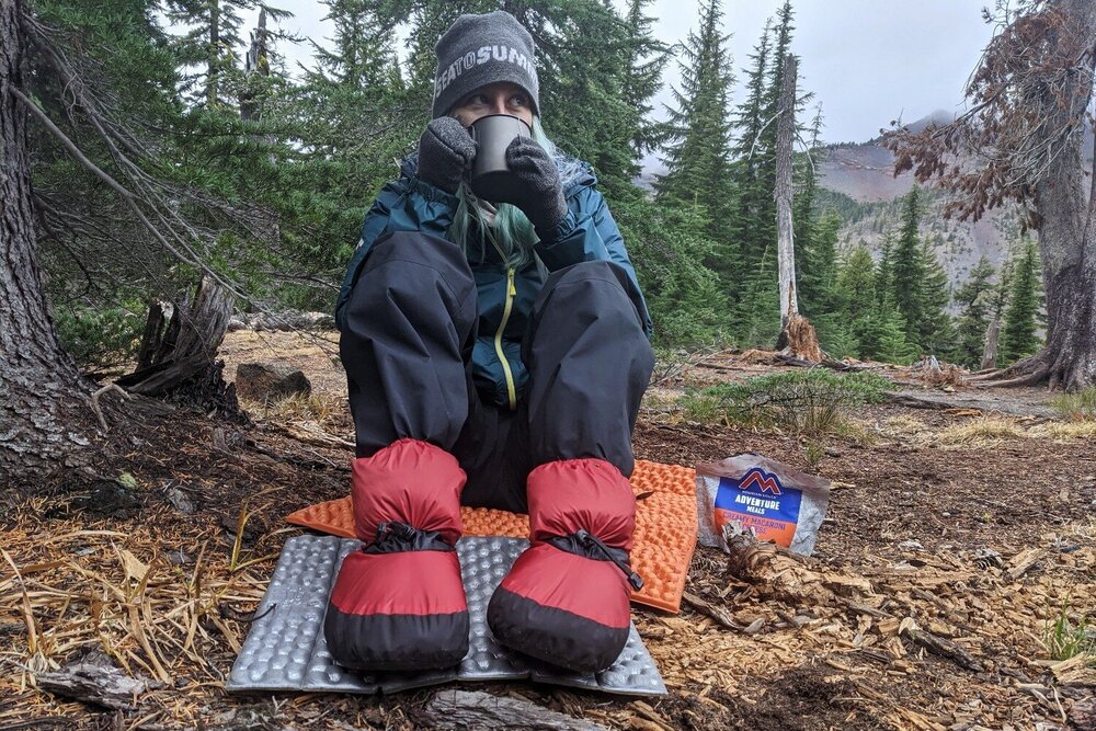 The Feathered Friends Down Booties are a comfy reprieve from your boots while in camp &amp; they can be worn in your sleeping bag to boost warmth.