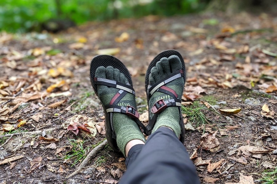 A view of a hikers feet wearing Chaco Z1 Classic Sandals and Injinji socks