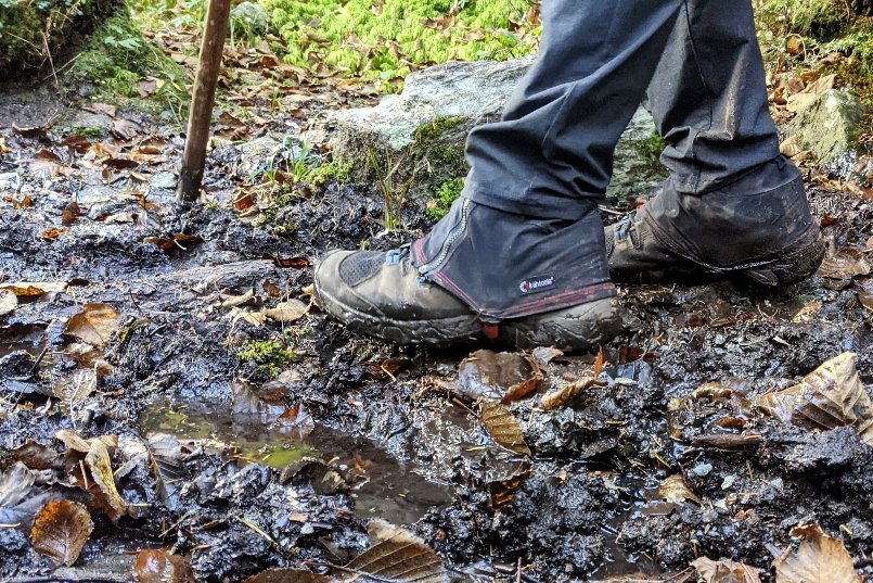 A view of a hikers feet wearing Keen Targhees and waterproof gaiters