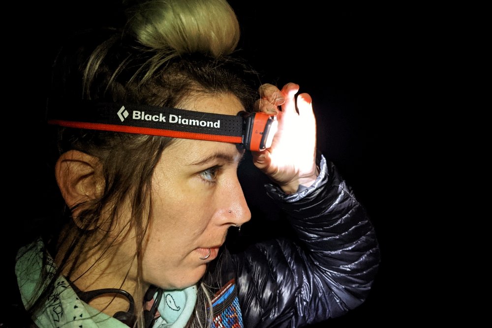 A hiker wearing the Black Diamond Spot 350 headlamp