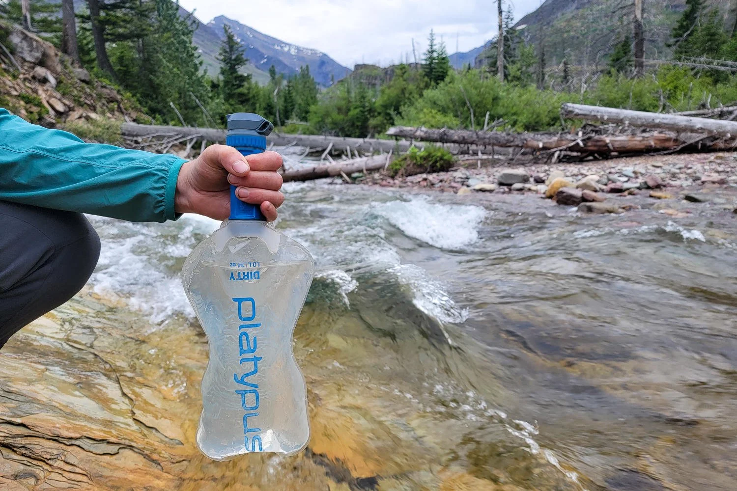 Closeup of a hiker gripping the filter cartridge of the Platypus QuickDraw