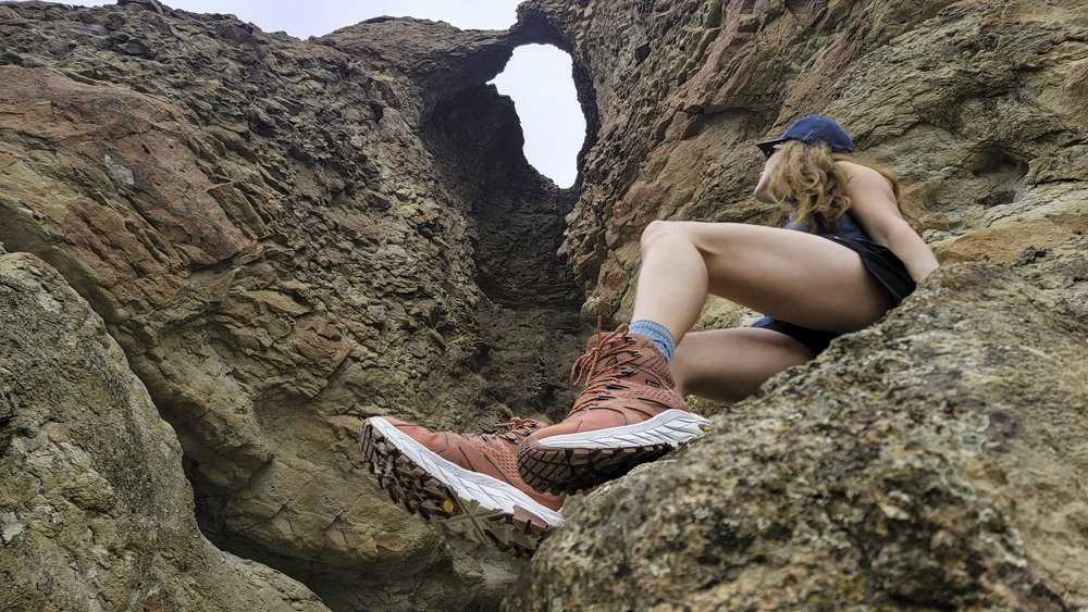 A woman hiking in the desert in the HOKA Anacapa Boots