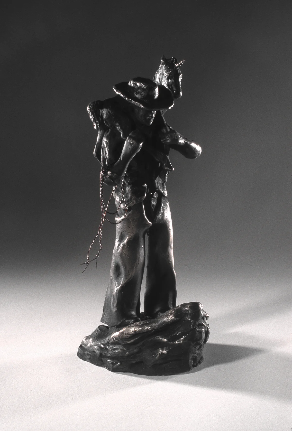 Cowboy and Baby Unicorn, bronze, 13" x 14" x 6", 1997