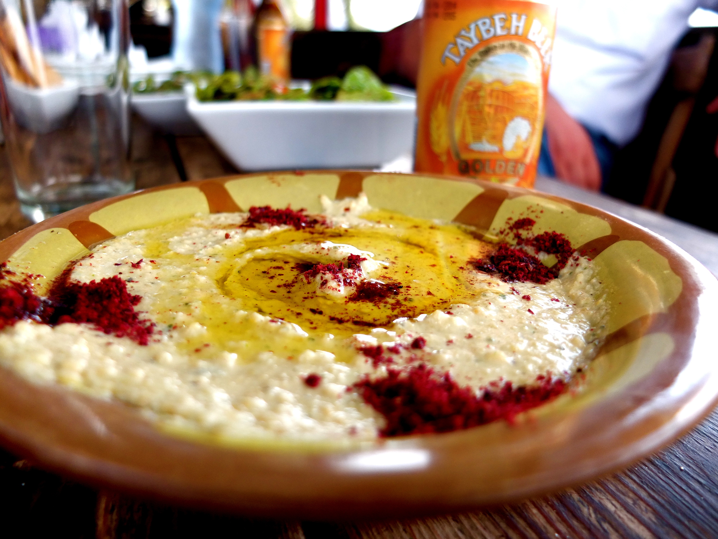    My first meal at Hosh Jasmin included this fabulous hummus, drizzled with their     olive oil and sprinkled with tart, deep red sumac. Hummus is of course quite     contentious in this part of the world. While the image—occasionally evoked—of     