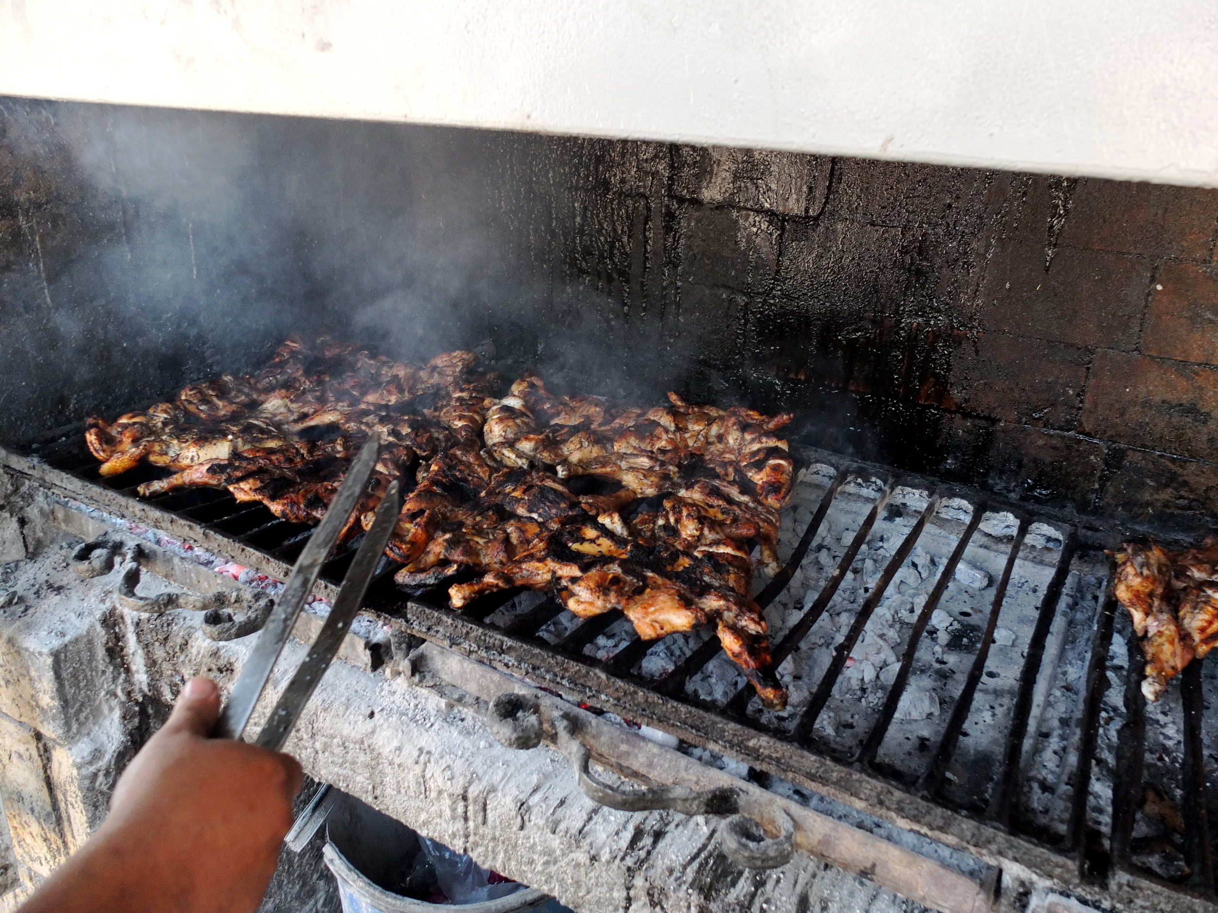    I’m not really sure what the secret to Qa’abar’s chicken is, but I was told that it’s     locally sourced and simply seasoned. This is the grill on which it’s prepared—of all     the photos in this collection, this is the one I wish I could smell.