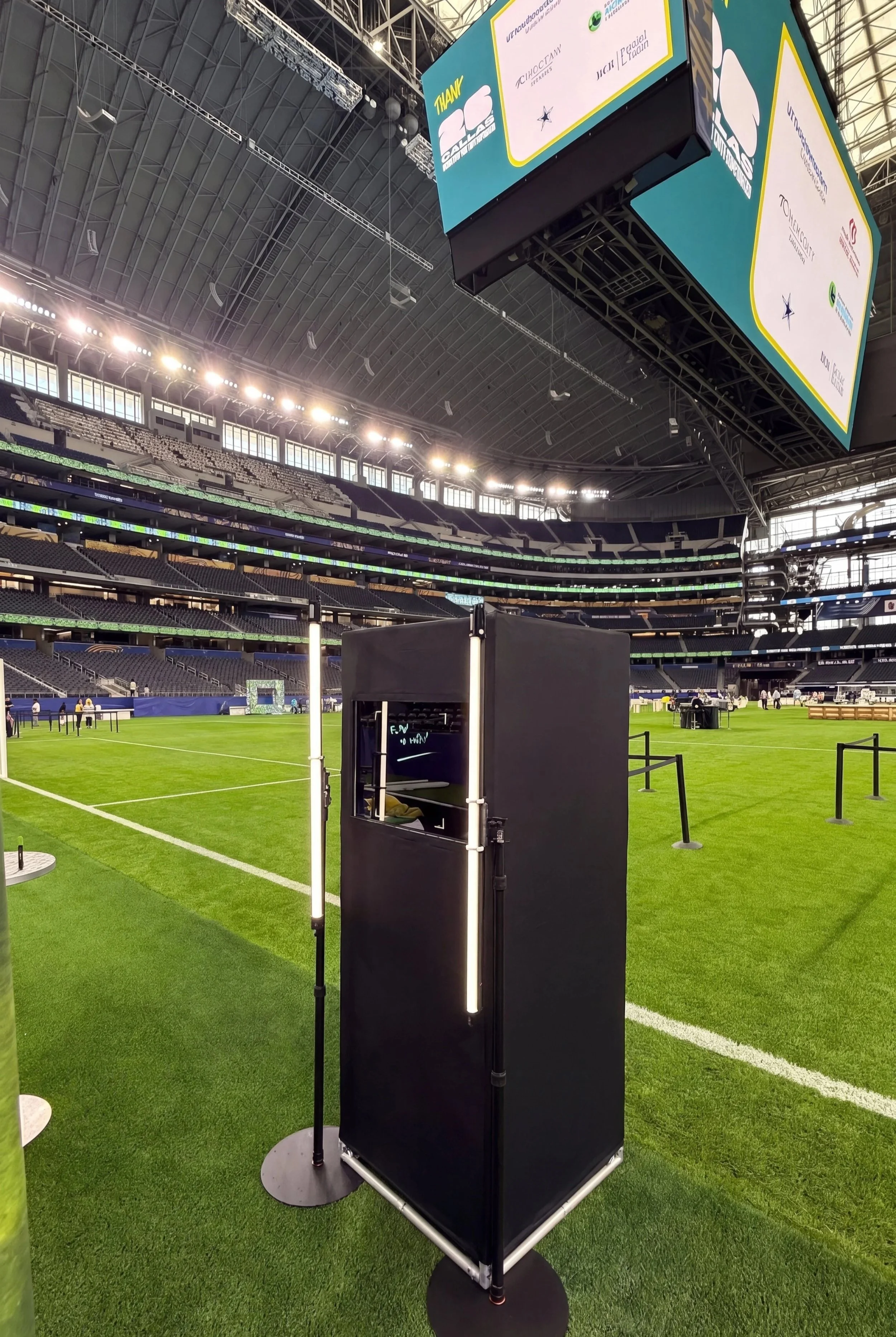 Scribble Booth setup with glass signing panel, camera, and lighting at a corporate event in Dallas