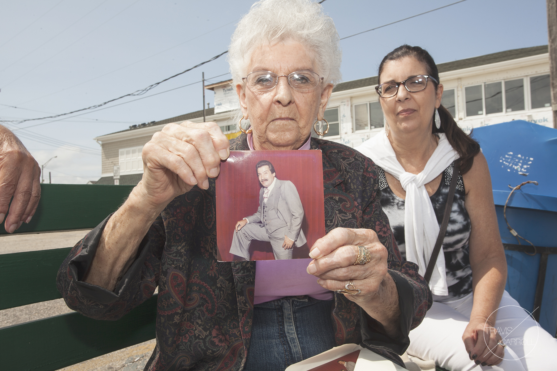 CARMINES WIFE AND DAUGHTER // Holding a photograph of Carmine somewhere around 40 years ago. 