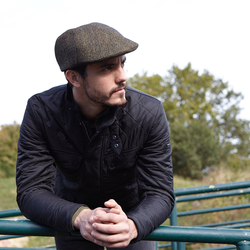 'Otley' flat cap in olive herringbone wool