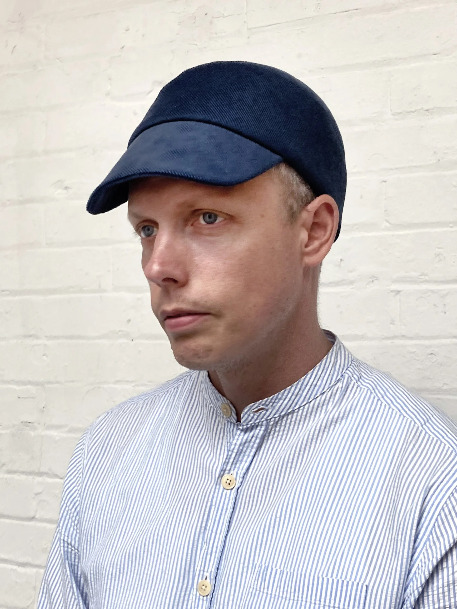 Richard wears 'Lewis' peaked cap