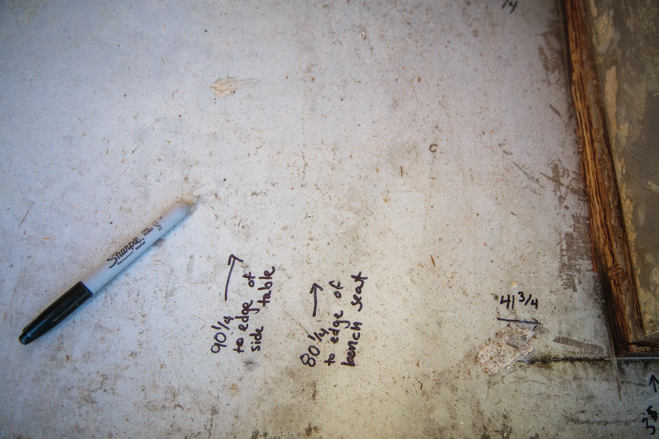 Measurements written on floor.