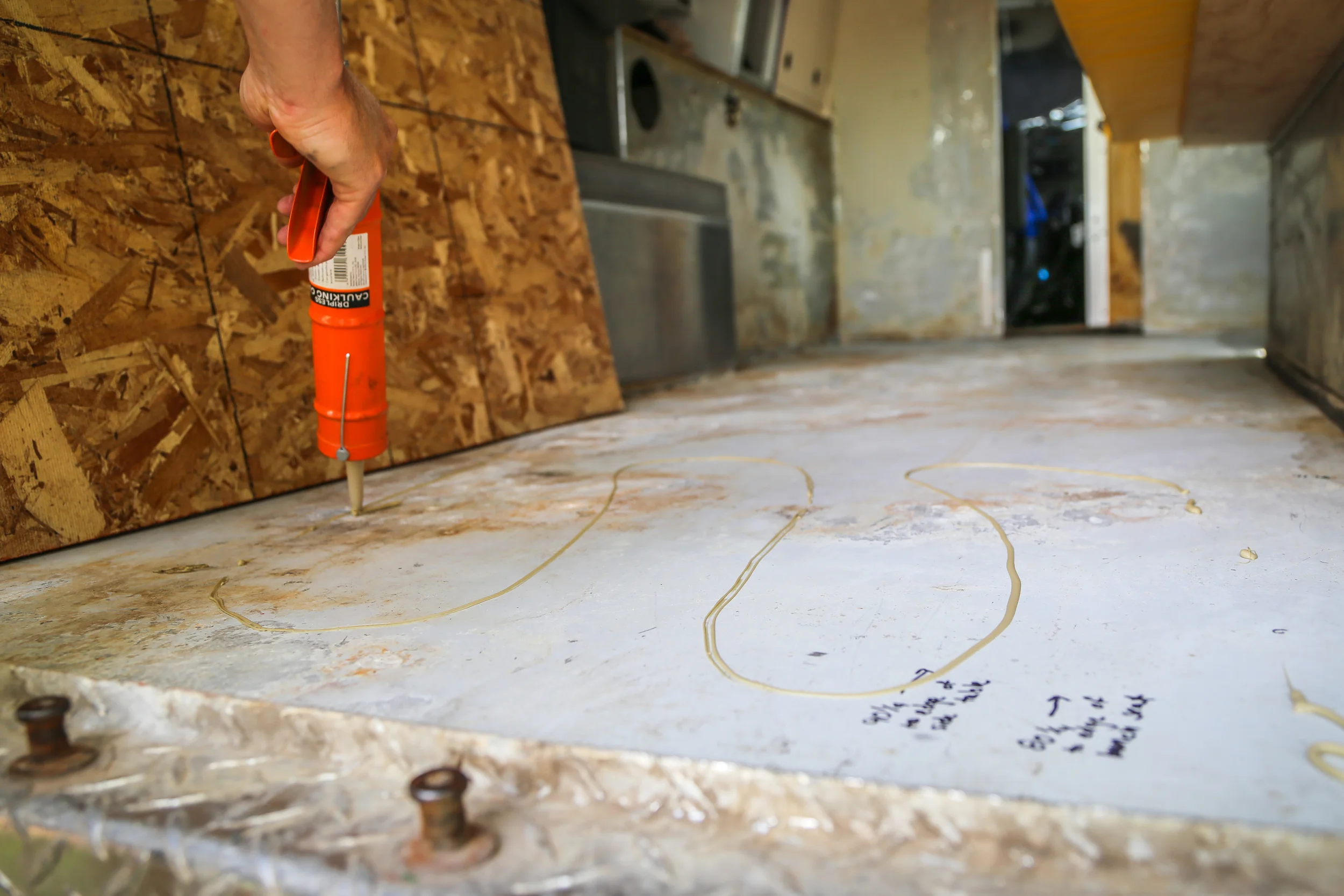 Laying glue down.