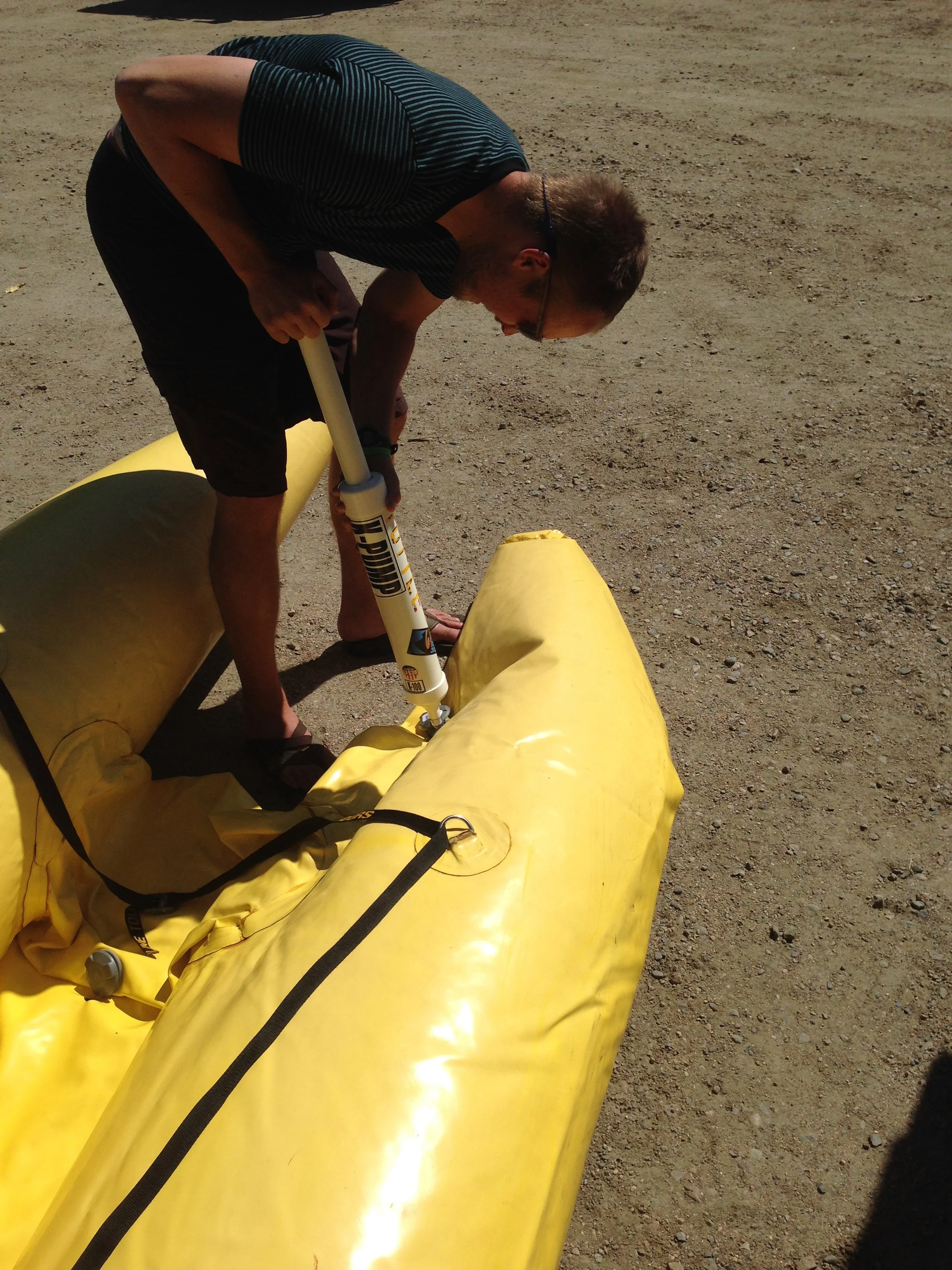 Pumping up the shredder with our hand K-pump. Thankfully, it's a small boat.