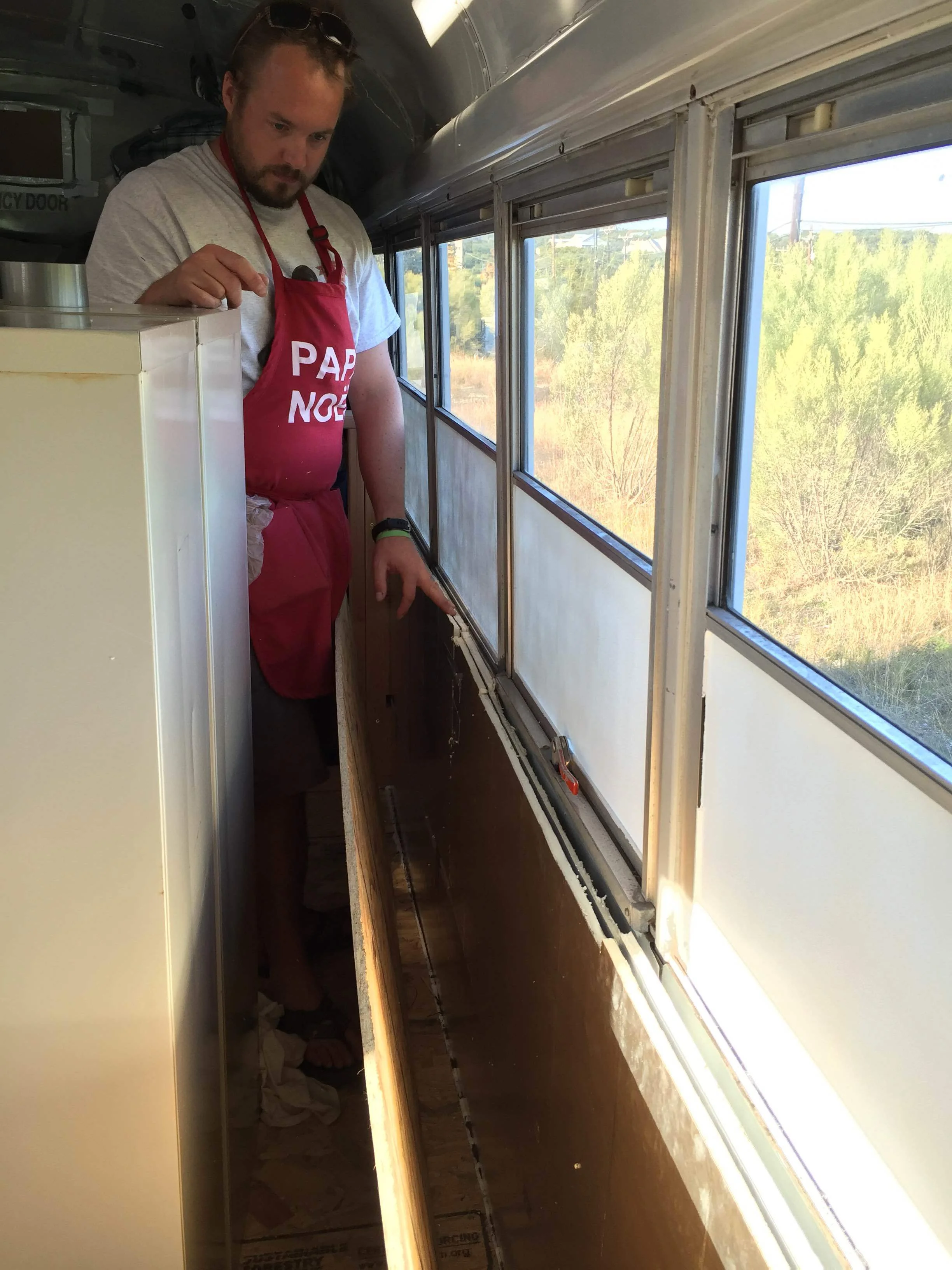 Christian added two layers of foam insulation to the walls before putting OSB over it for some extra insulation. Now that we had a working heater, we realized how much some simple walls and insulation would help our cause.