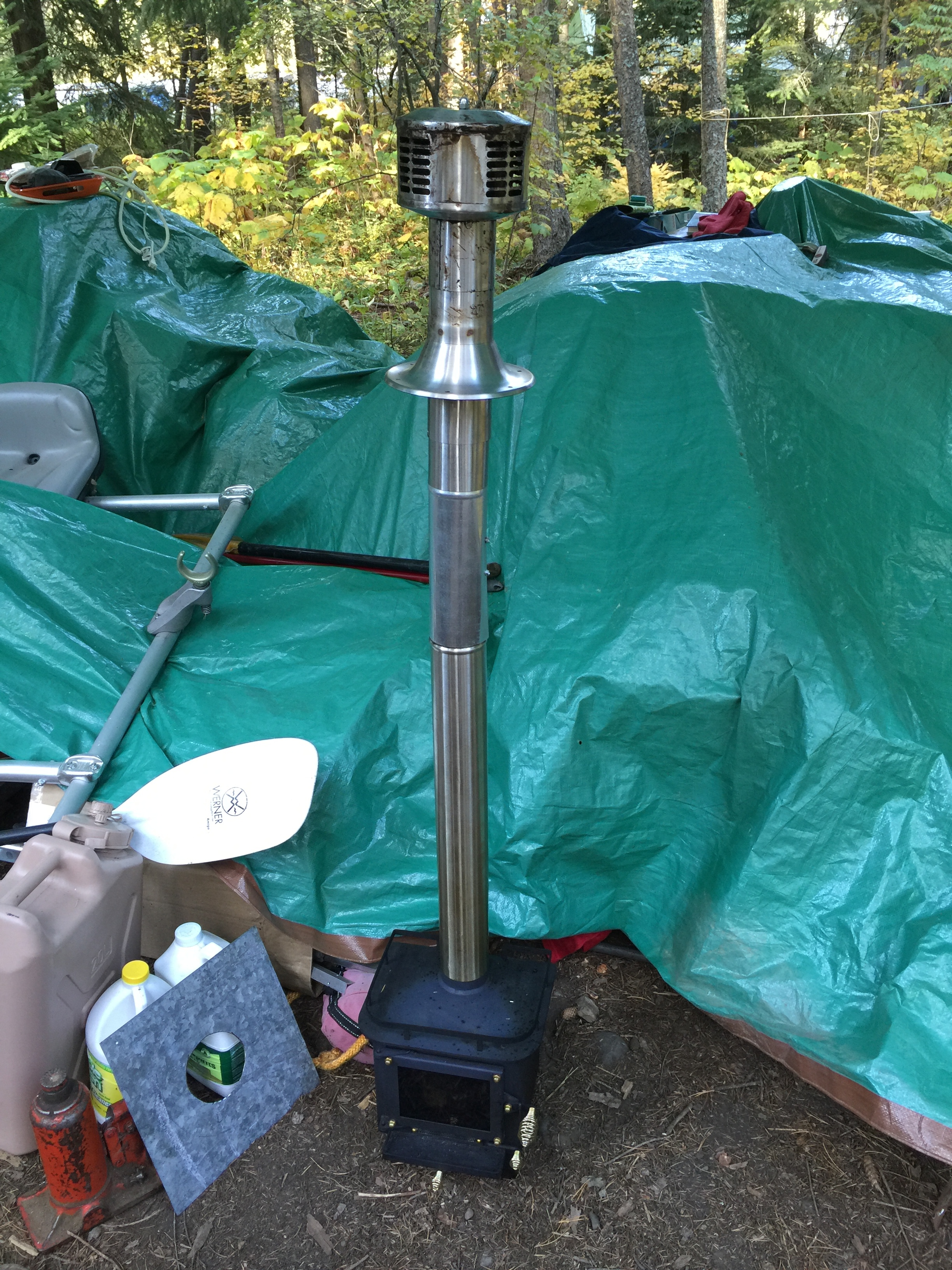 The stove assembled with a piece of galvanized steel beside it that would make the vent hole the correct size.