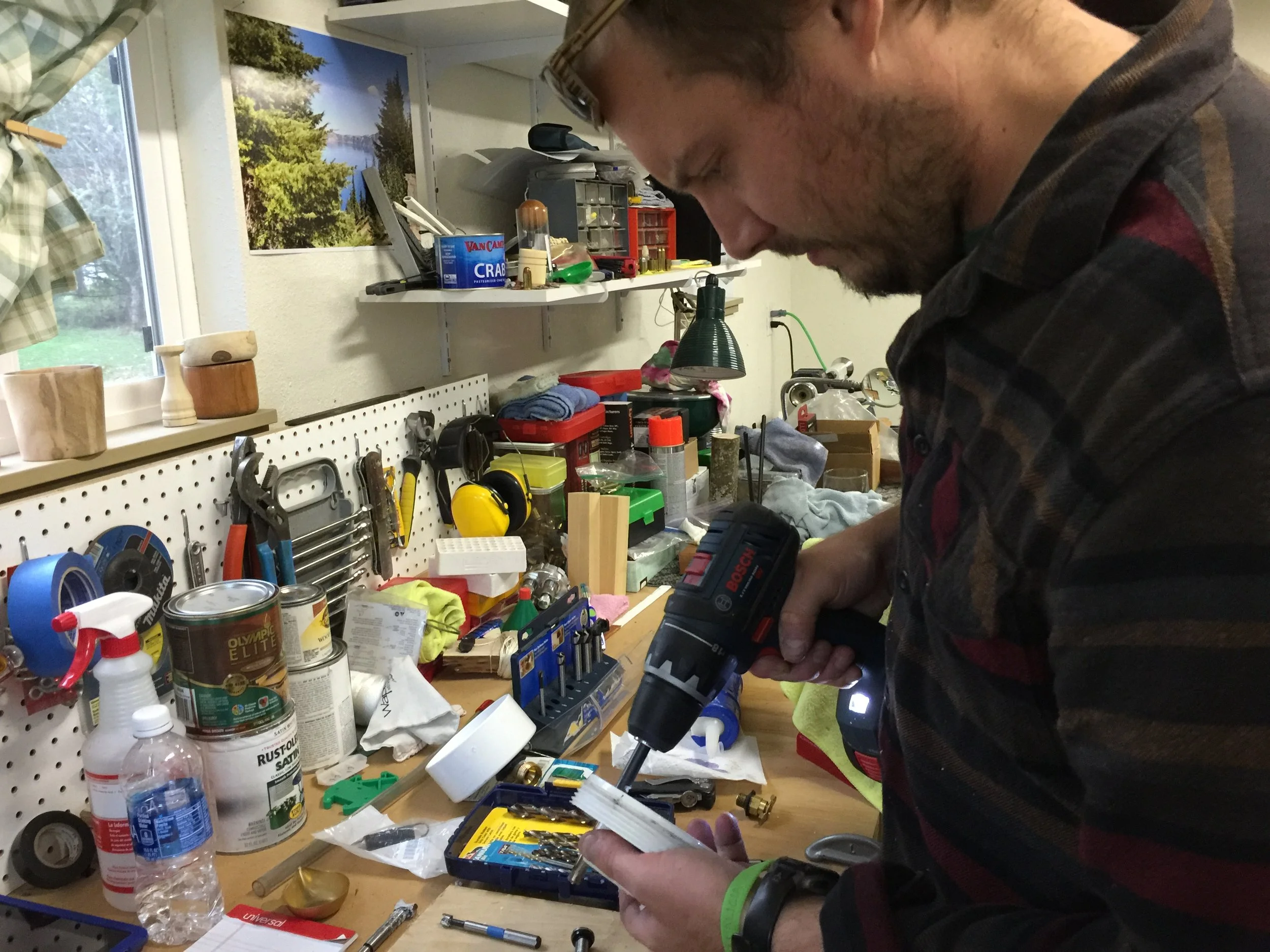 Installing valves into the screw cap on the T-joint.