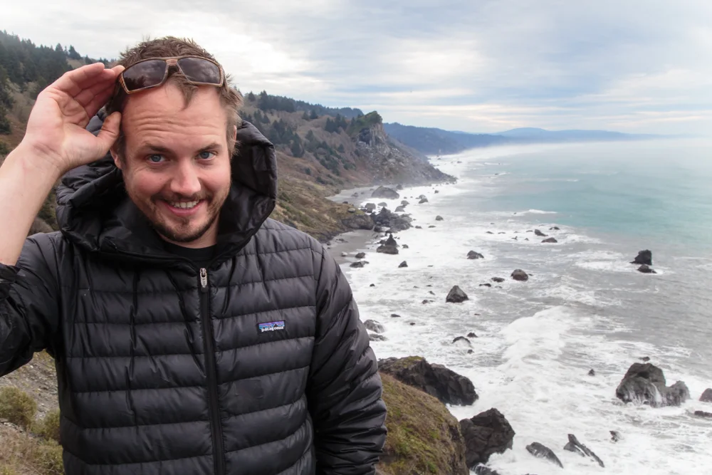 Posing with a coastline At High Bluff Overlook. This is me looking greasy.