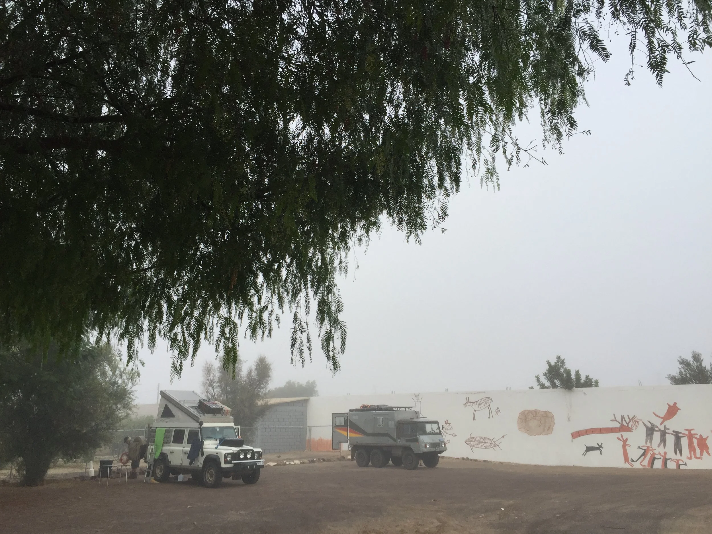 The foggy camp spot. Cool trucks camp together.