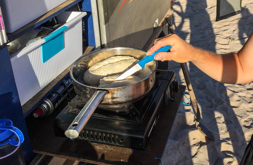 Prepping bread. We baked it in coals, not on the burner.