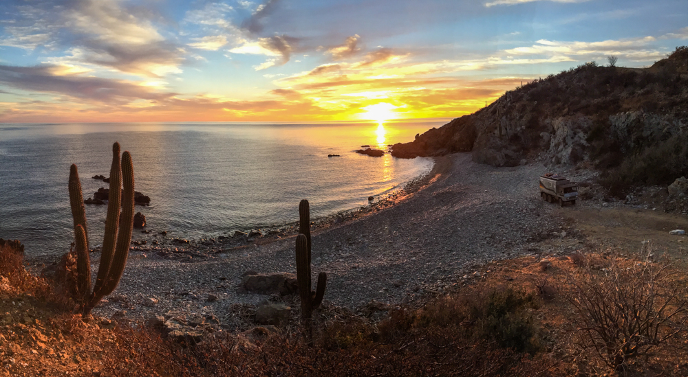 The rocky cove at sunrise that earned Mauricio the cover of the Rovers North calendar.