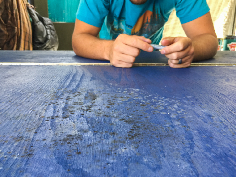 Planning my holes to add at least a little air flow. Don't worry…we thoroughly bleached and scrubbed all of this off.