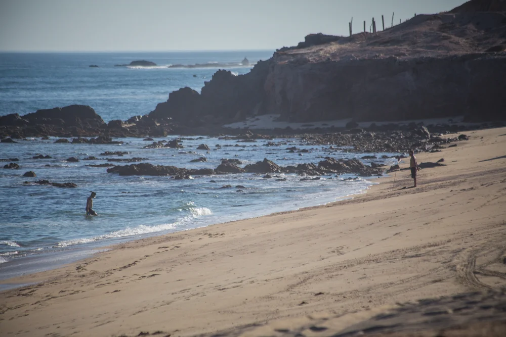 Riley, waiting for me to follow him out of the surf. I know it looks calm, but i just got beat down over a reef filled with sea urchins. 