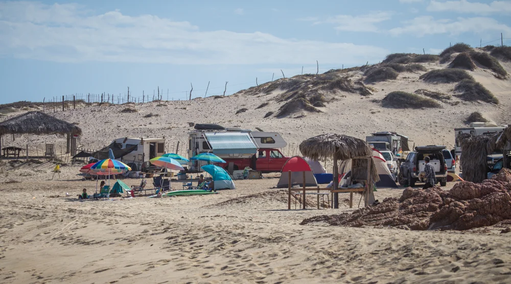 Tents and umbrellas took over and we eventually lost our view of the waves. You can see Little Foot tucked back in behind the crowds. (At least we had privacy in our spot.)
