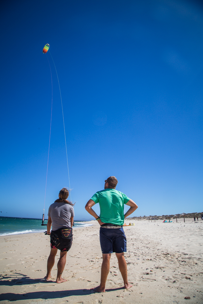 Pablo with his hands on the auxillary control bar, which slows down the control of the kite.