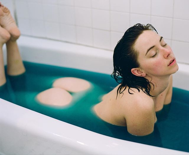 @miss_kaciemarie in a blue bath.
