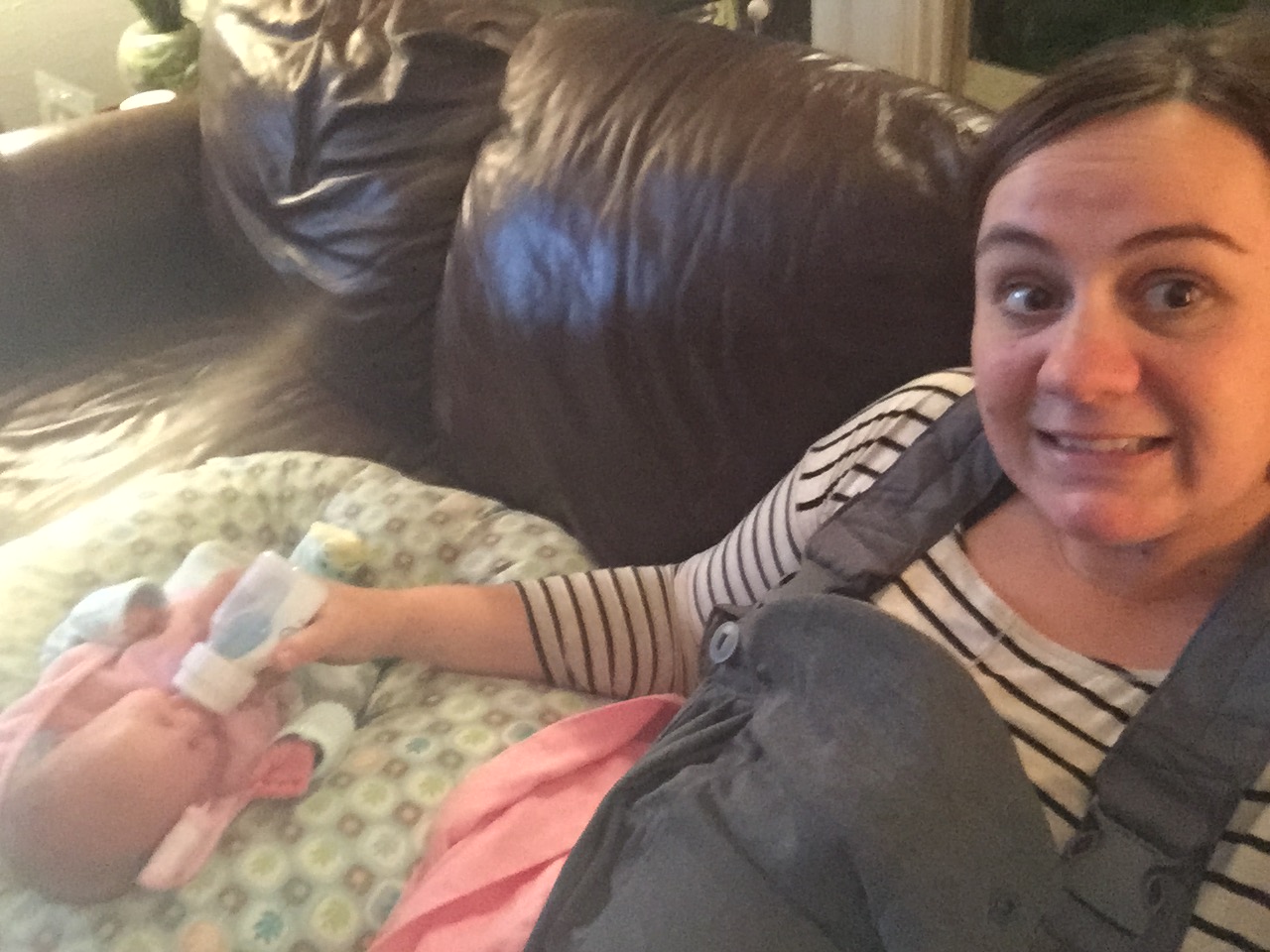 I was almost in my third trimester in this picture...not the best picture, but little Angie was snug in that carrier! (name changed)
