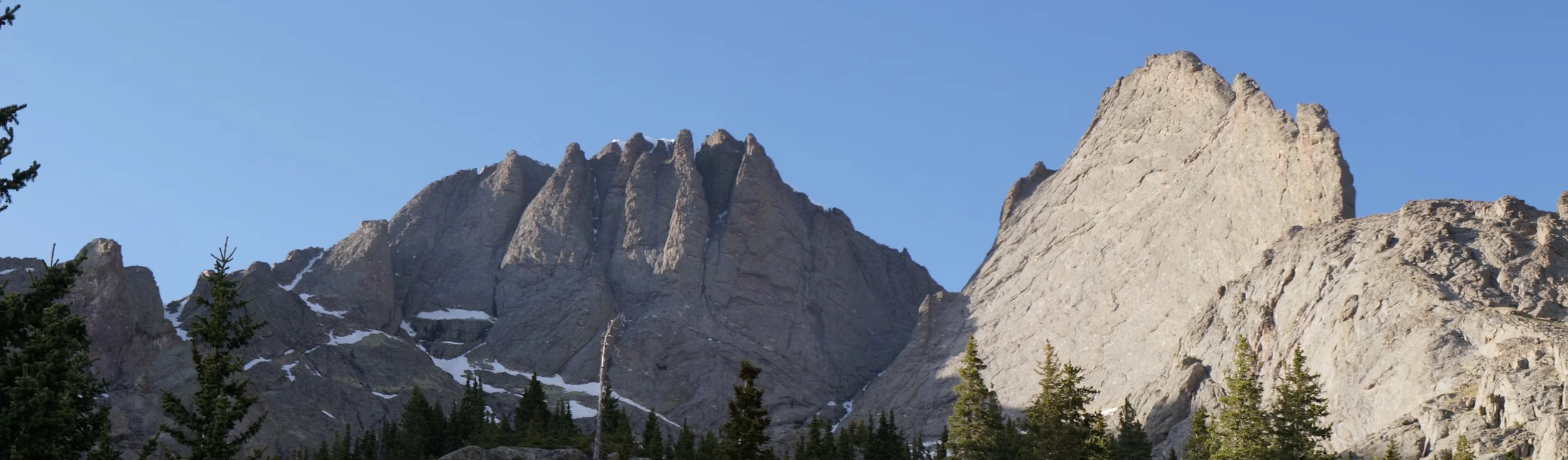 Kit Carson's "Prow" route is the sunlit arete on the right. Challenger is another 14,000' peak in the center. 