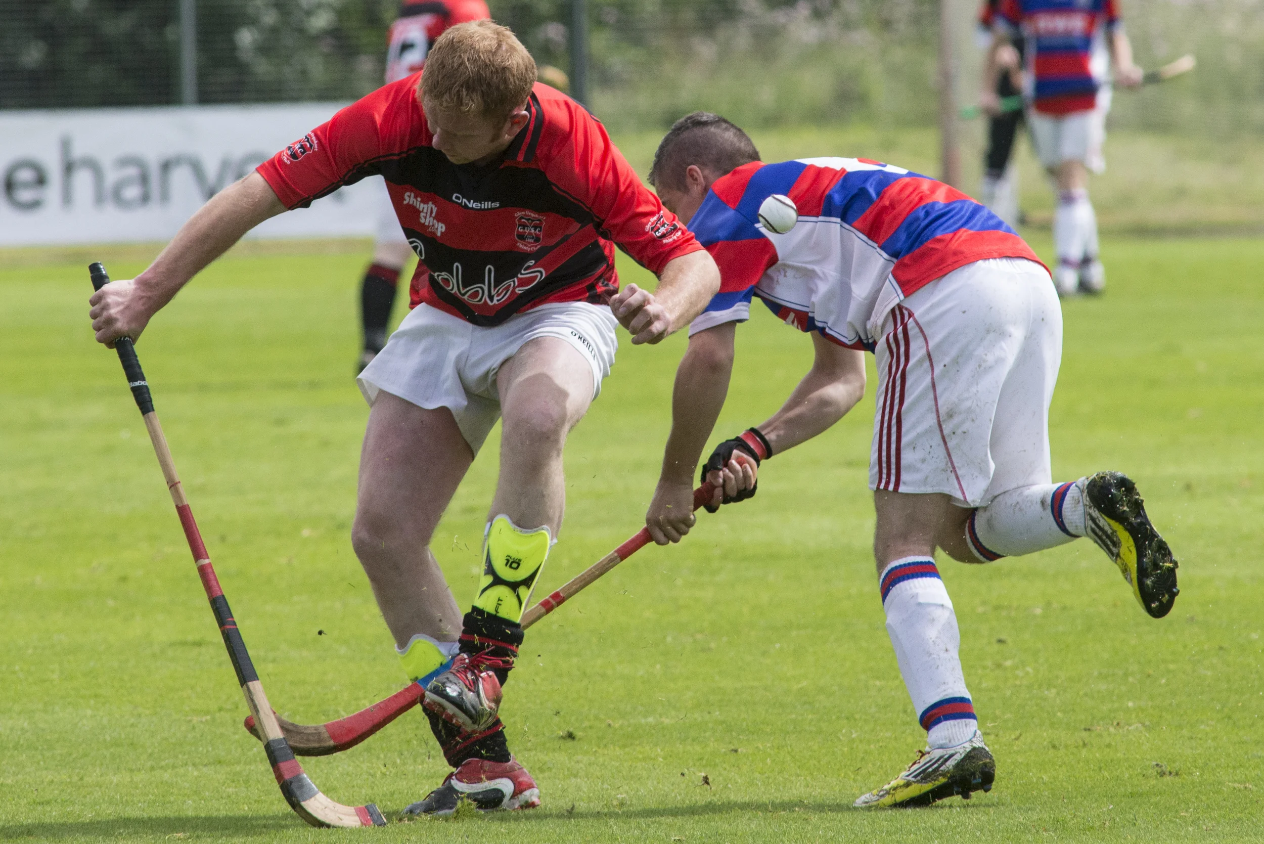 Kingussie shinty player Jake MacPherson (right) fights for control of the ball using his caman against his Glenurquhart opponent at The Dell in Kingussie, Scotland on Saturday, August 1, 2015. Shinty is unique to Scotland and one of the oldest games in the world. The Dell playing fields at Kinguisse are considered by some to be the original home of organised shinty as we know it today. 