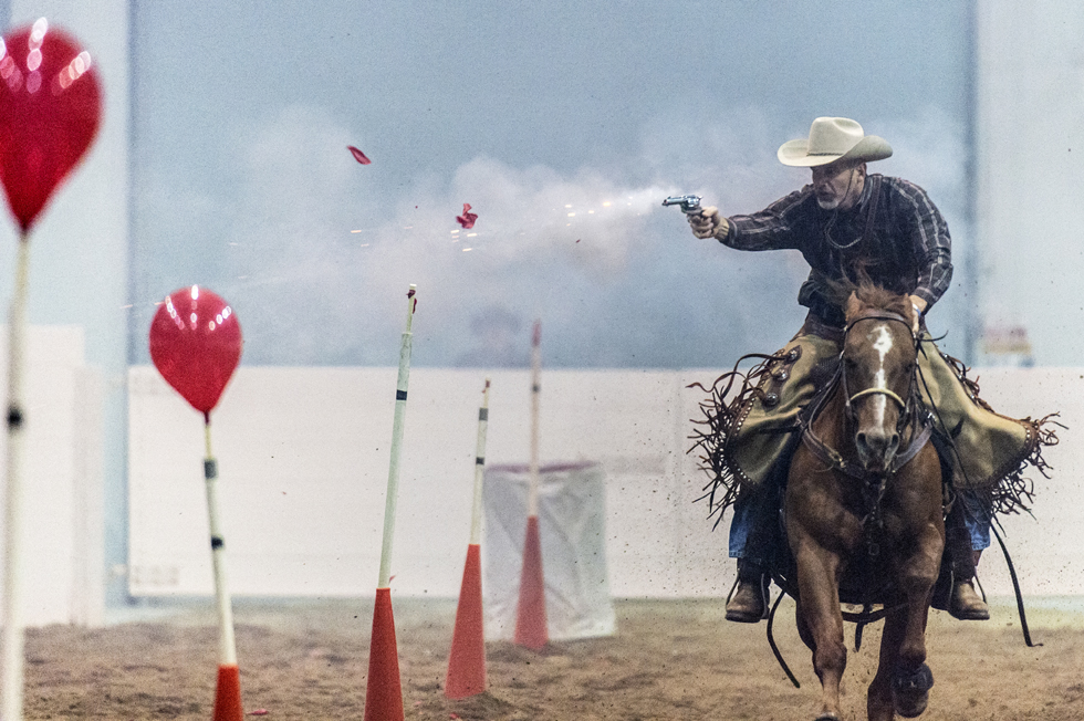 Eric Schreiber shoots the targets in the “rundown” during the 2015 American Quarter Horse Congress shootout in Columbus, Ohio. 