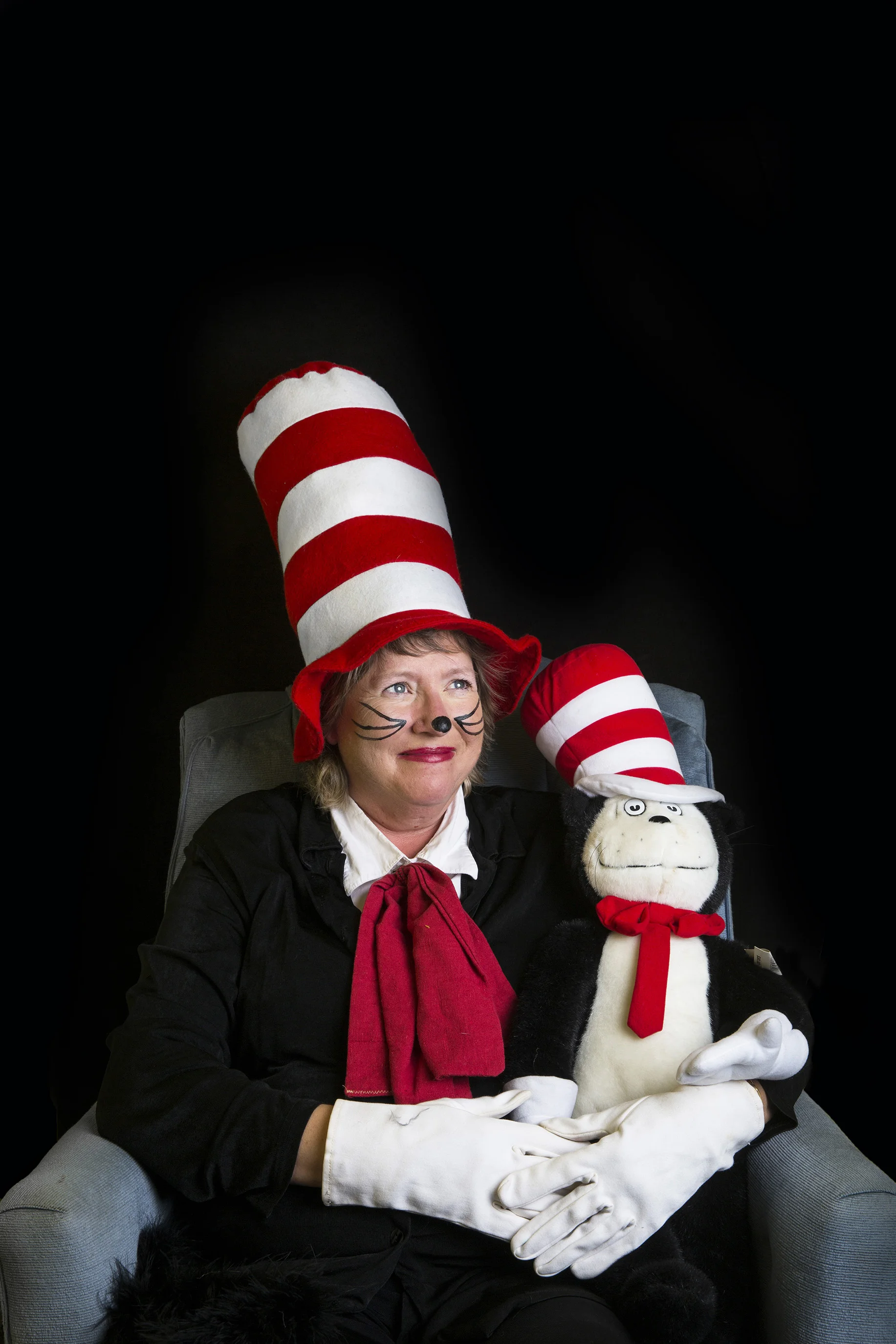  Connie Bettinger-Hennink, 53, dressed as Dr. Seuss' iconic character Cat in the Hat, poses for a portrait in her Golden Gate home on Tuesday, Dec. 20, 2016. For the past 25 years, Connie has visited schools and libraries in Southwest Florida as a Ca