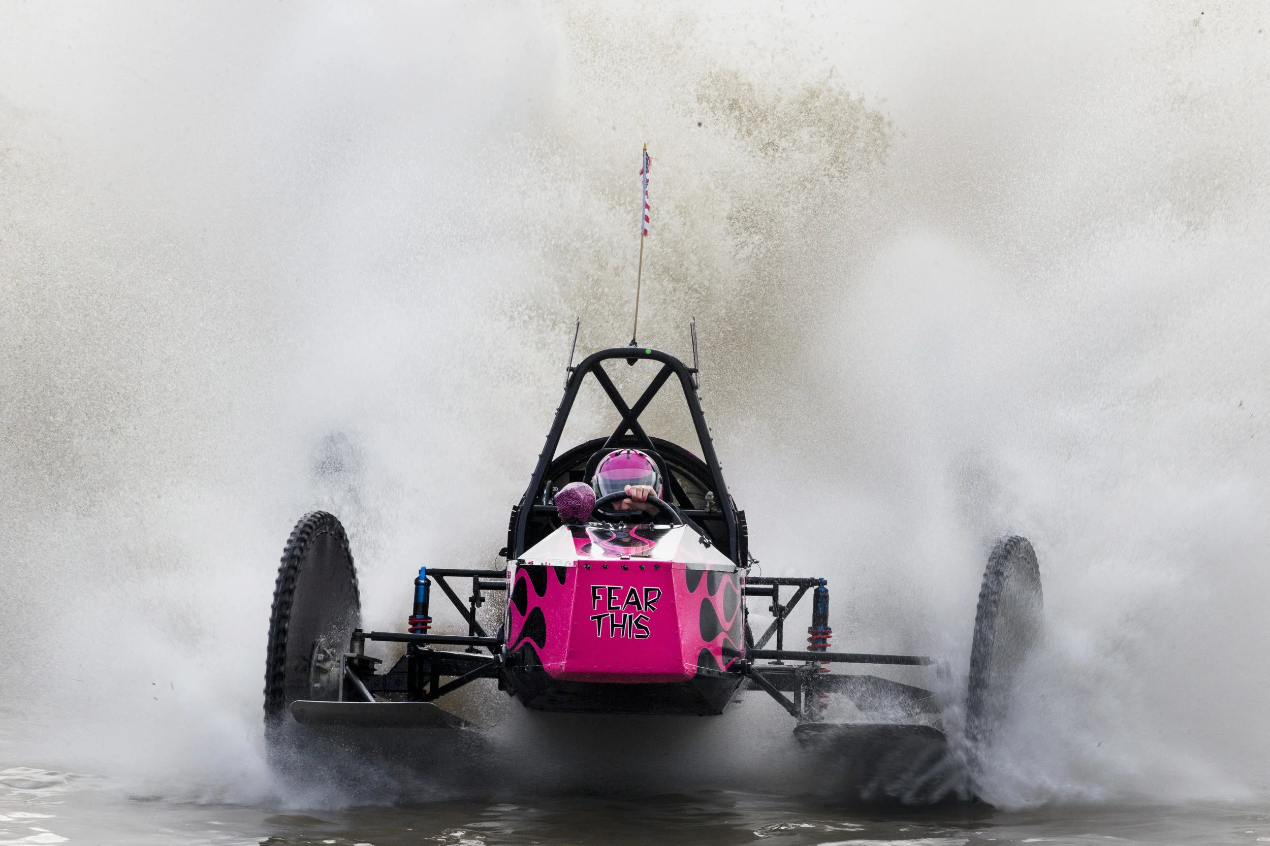 Fatal Attraction driver Bonnie Walsh, 57, crosses the finish line to win the Big Feature in 54.35 seconds during the Budweiser Winter Classic swamp buggy races at Florida Sports Park in Naples, Florida on Sunday, Jan. 29, 2017. This weekend was her first time racing since her husband and fellow swamp buggy driver, Terry “T-Bone” Walsh, died in March 2016.