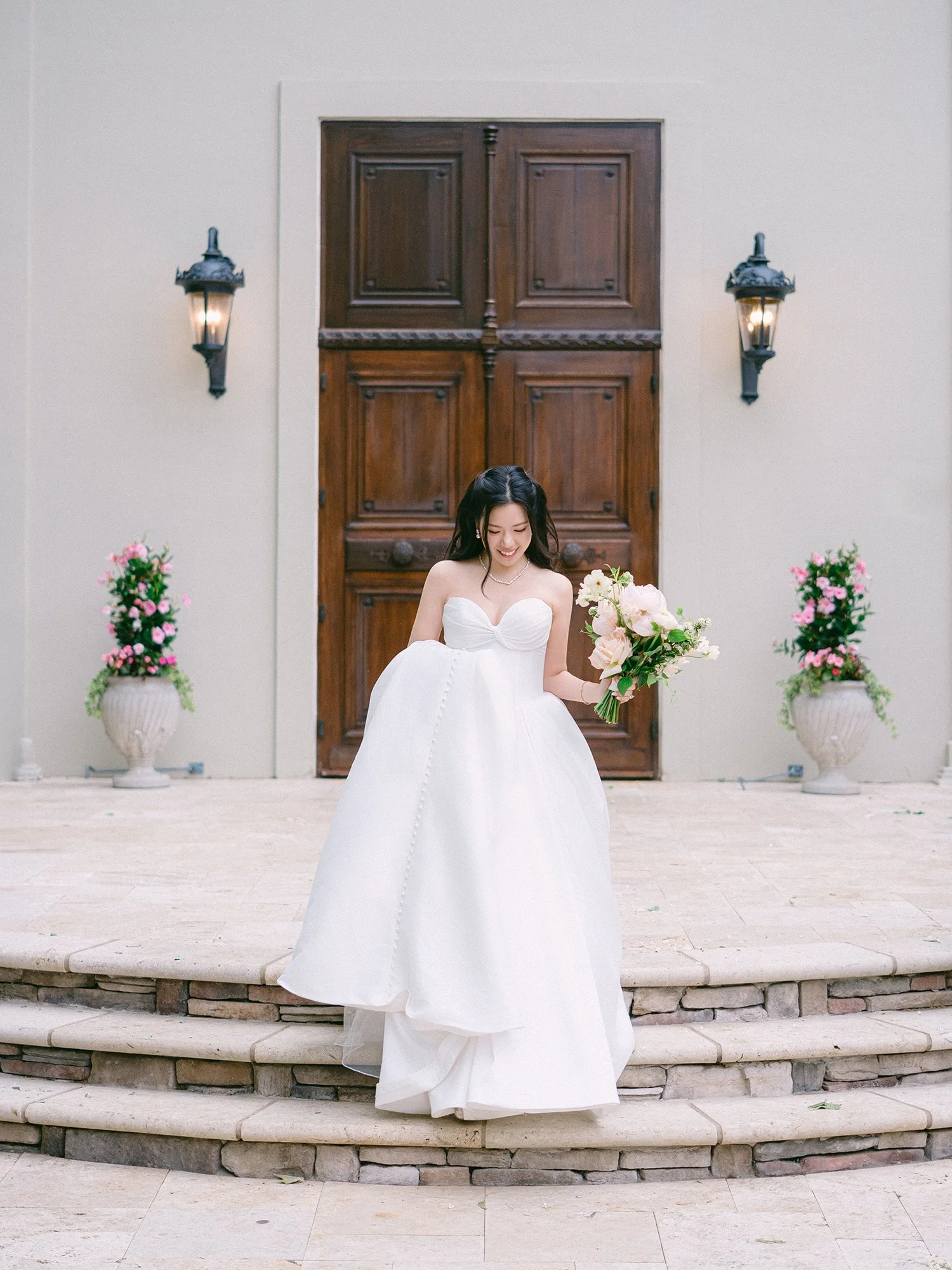  A bright and airy wedding portrait of Joann and Thomas sharing a romantic moment inside the elegant Nanina's in the Park venue. 