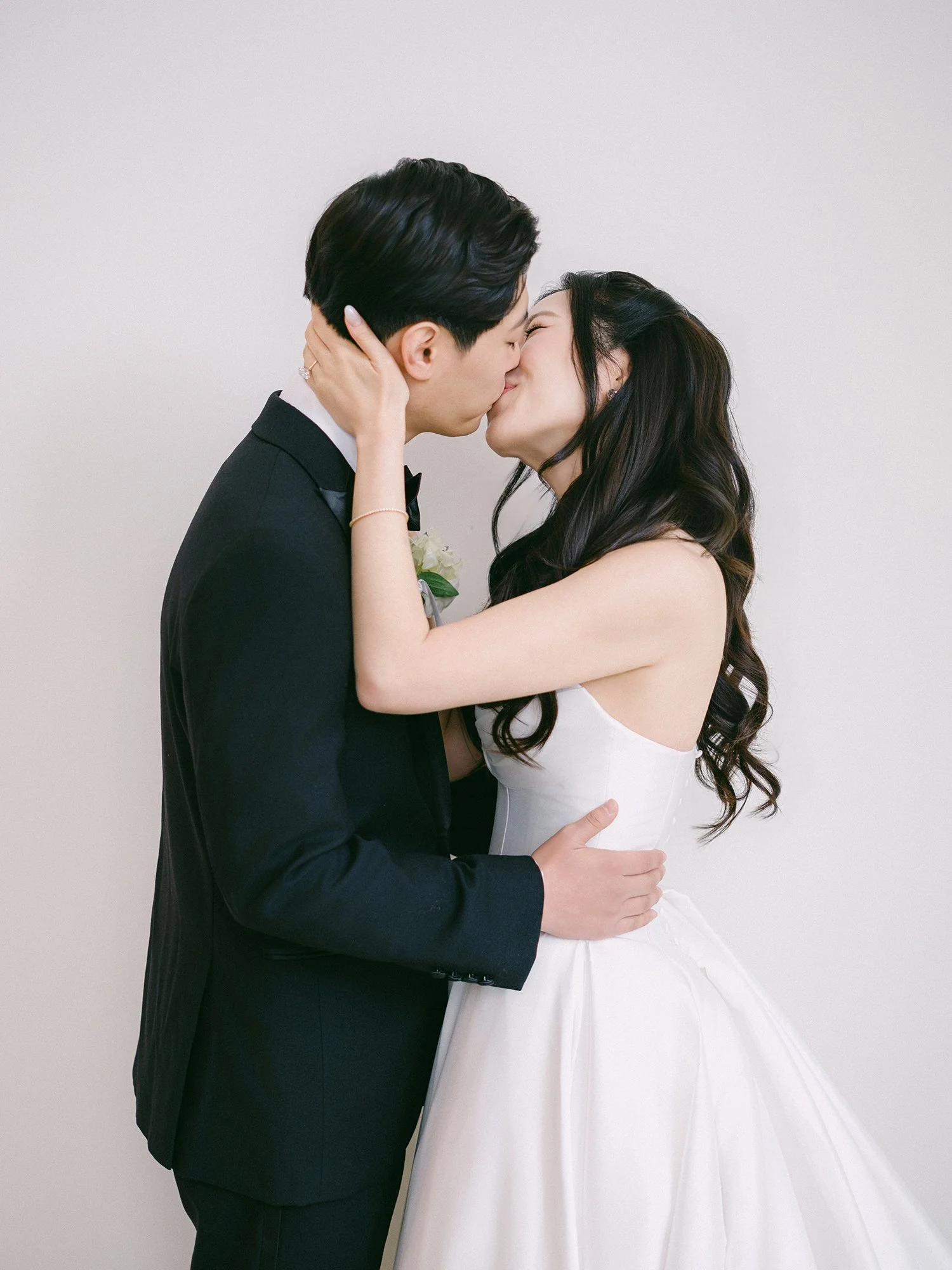  A bright and airy wedding portrait of Joann and Thomas sharing a romantic moment inside the elegant Nanina's in the Park venue. 