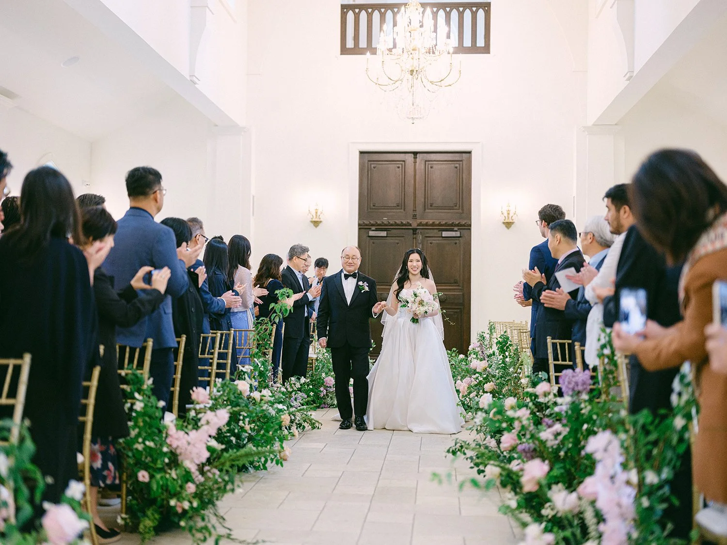  A bright and airy wedding portrait of Joann and Thomas sharing a romantic moment inside the elegant Nanina's in the Park venue. 