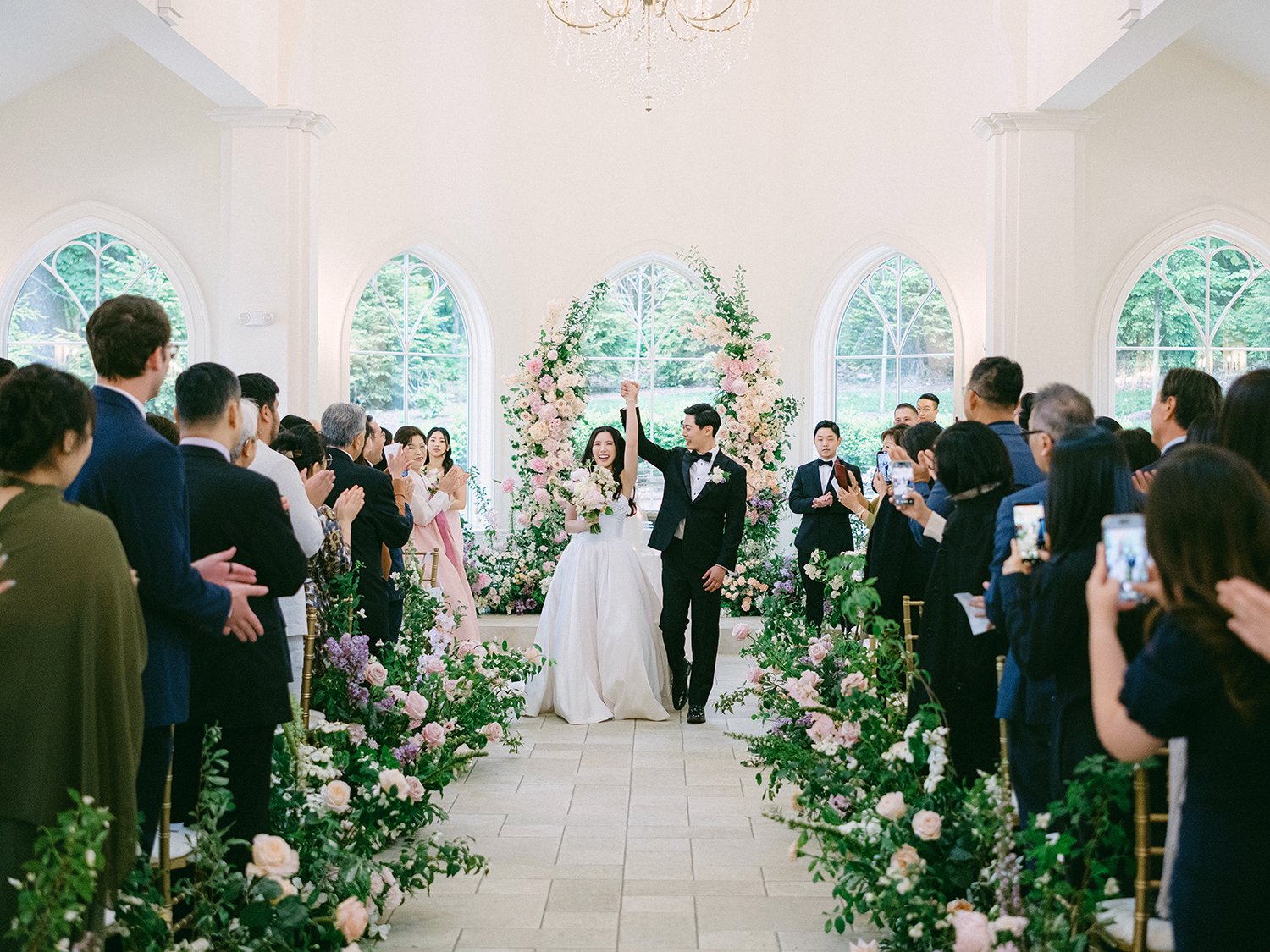 A bright and airy wedding portrait of Joann and Thomas sharing a romantic moment inside the elegant Nanina's in the Park venue. 