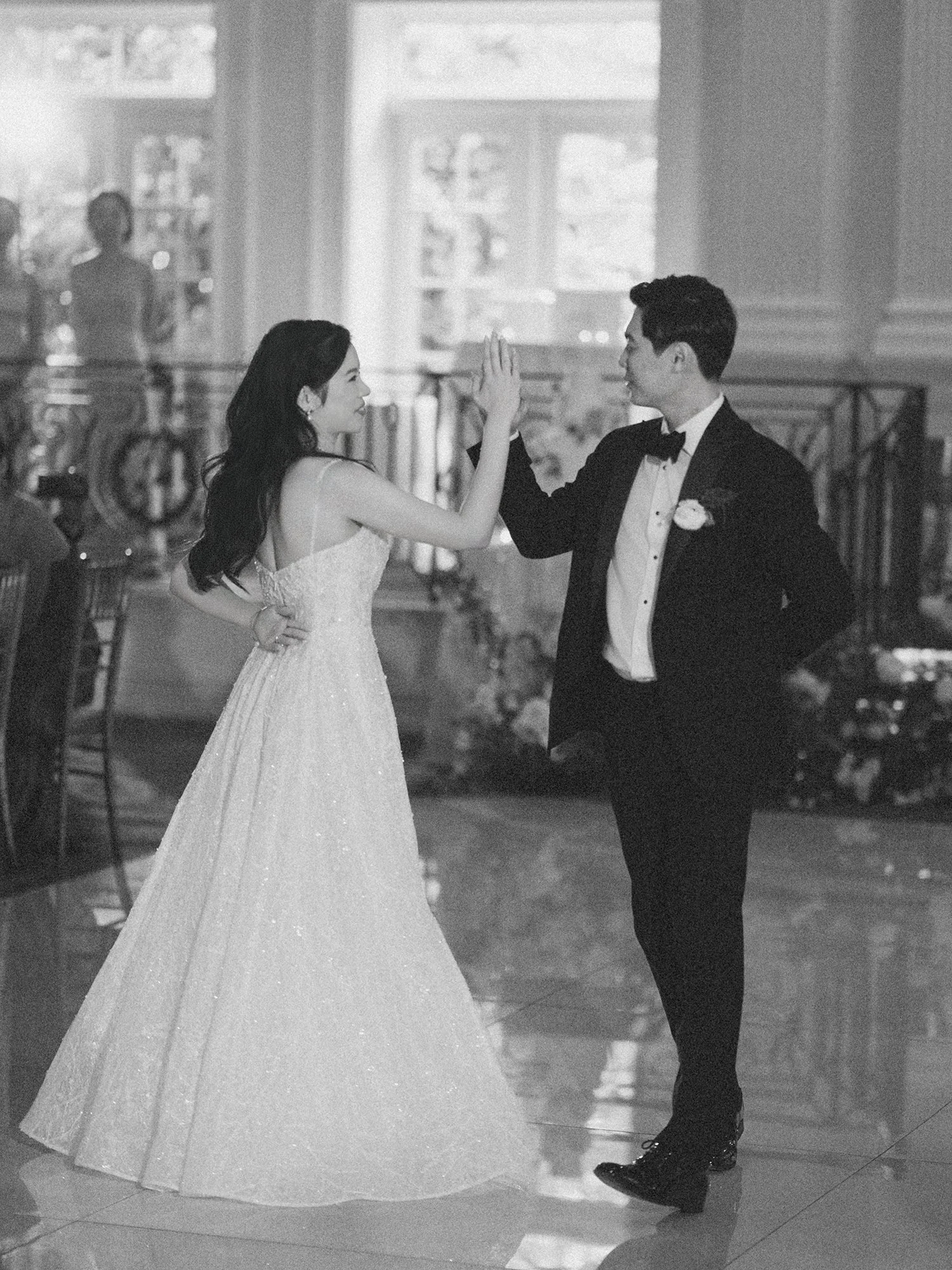  A bright and airy wedding portrait of Joann and Thomas sharing a romantic moment inside the elegant Nanina's in the Park venue. 