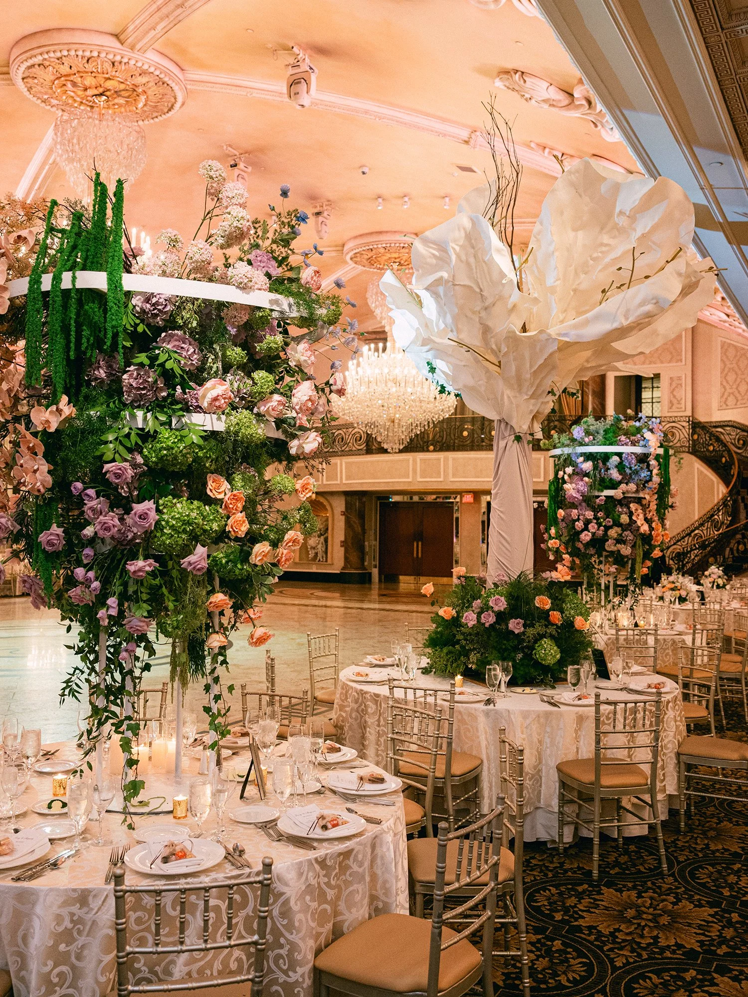  A grand and vibrant wedding portrait of Jenny and Shay sharing a joyful moment inside the luxurious ballroom of The Venetian in New Jersey. 