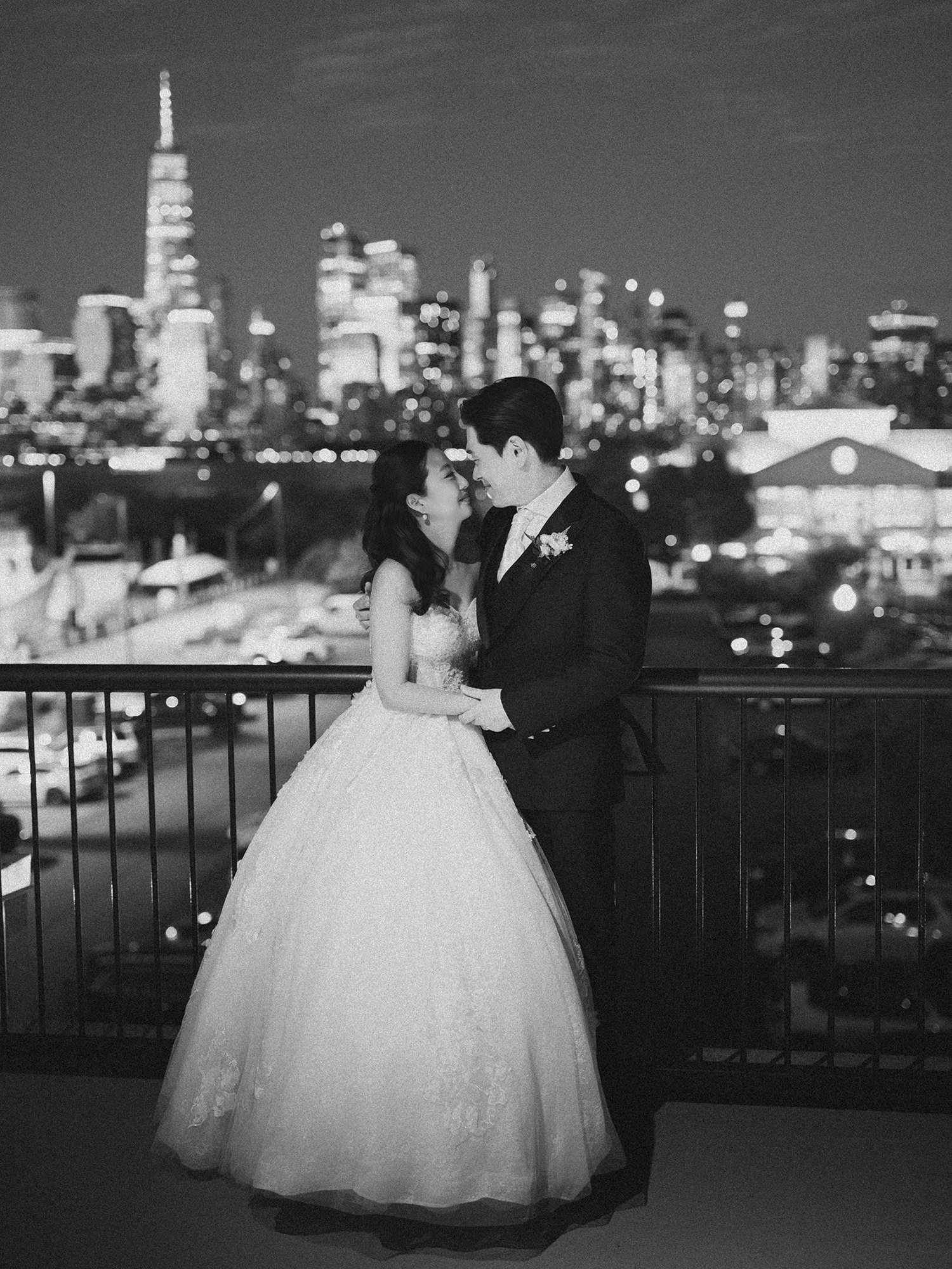 Wedding portrait of Jennifer and Andy at Maritime Parc NJ with the sunny Manhattan skyline in the background by Haseok Chung Studio.