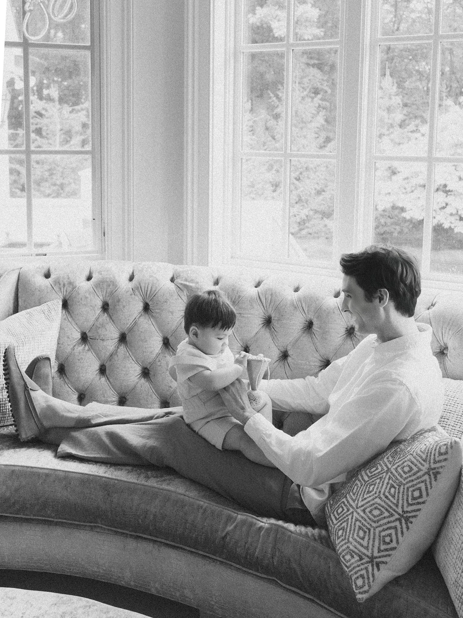 Candid moment between parents and their one-year-old son