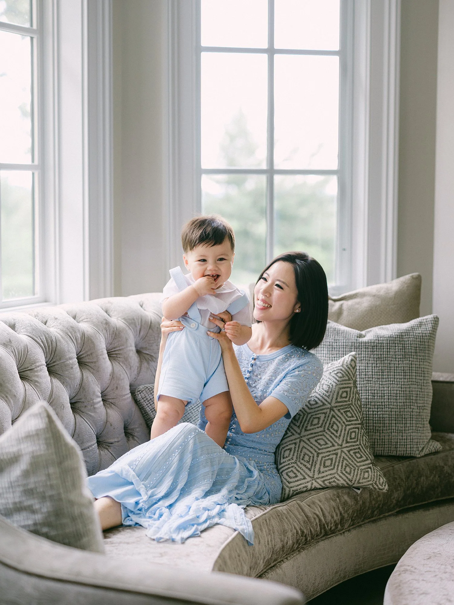 Candid moment between parents and their one-year-old son