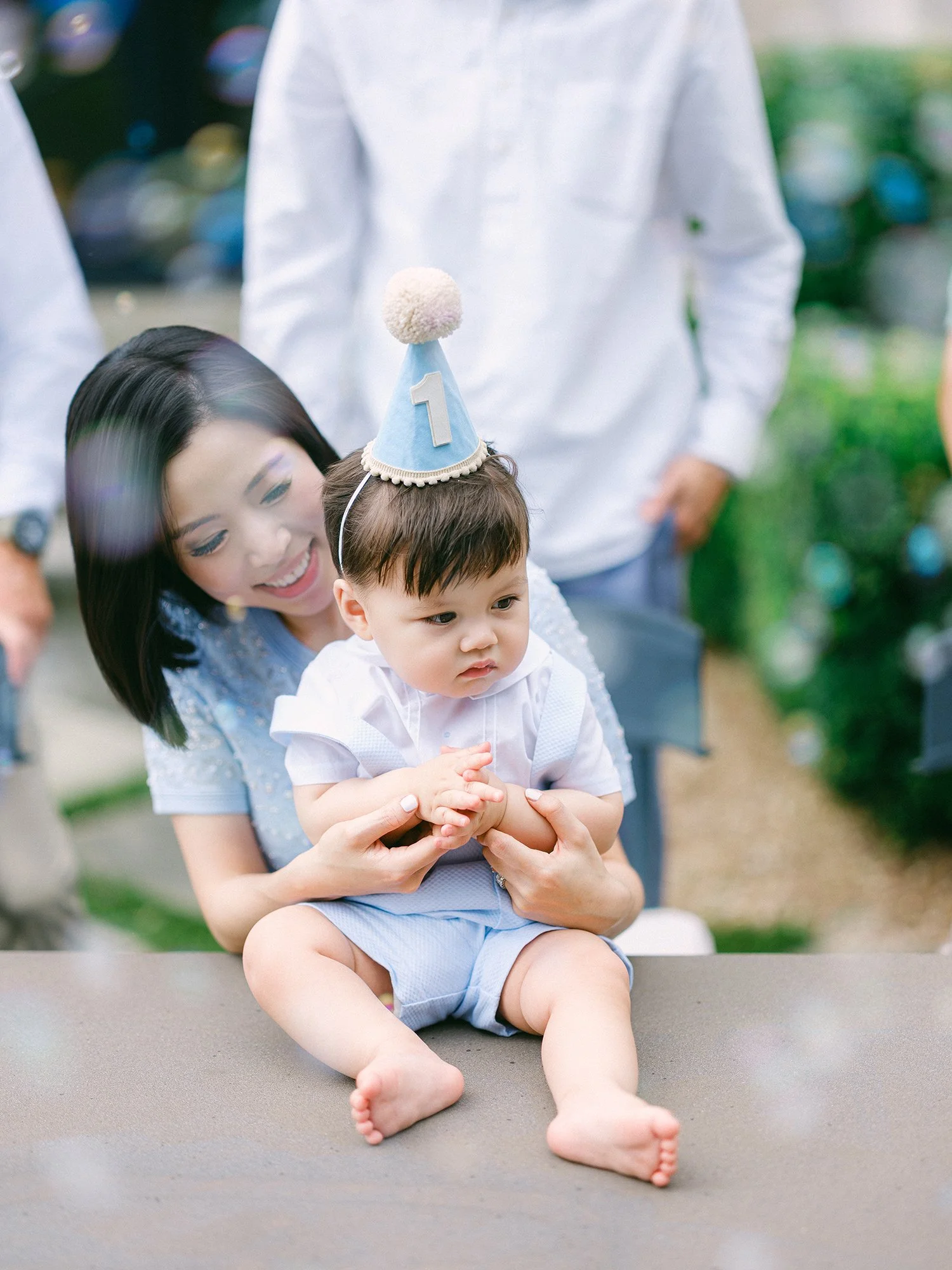 Candid moment between parents and their one-year-old son