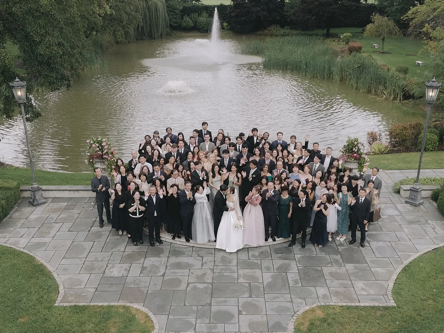 Wedding guests gathering outside Park Chateau after the rain