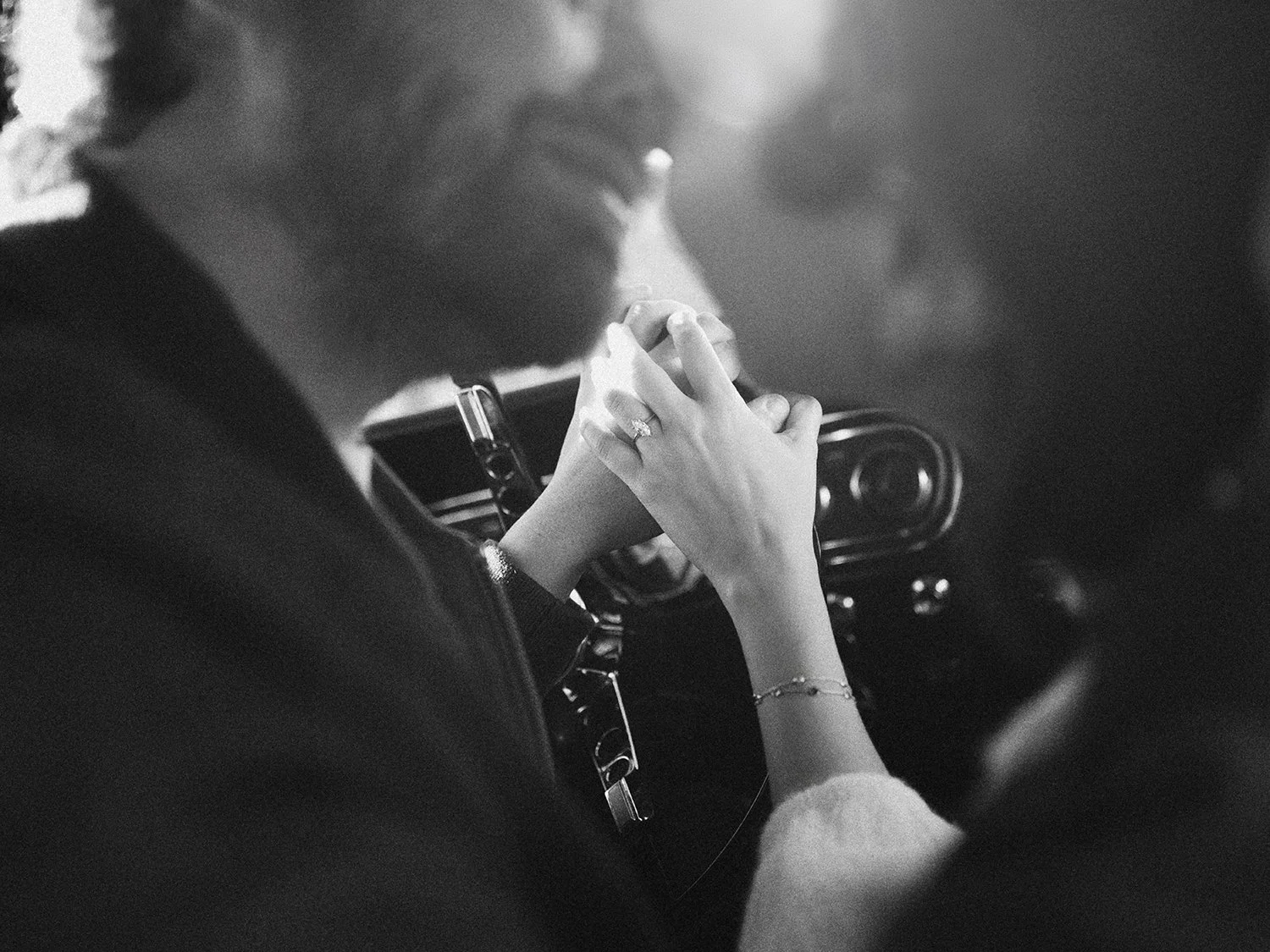 The couple with a red 1960s Ford Mustang at their engagement session in Milton, New York
